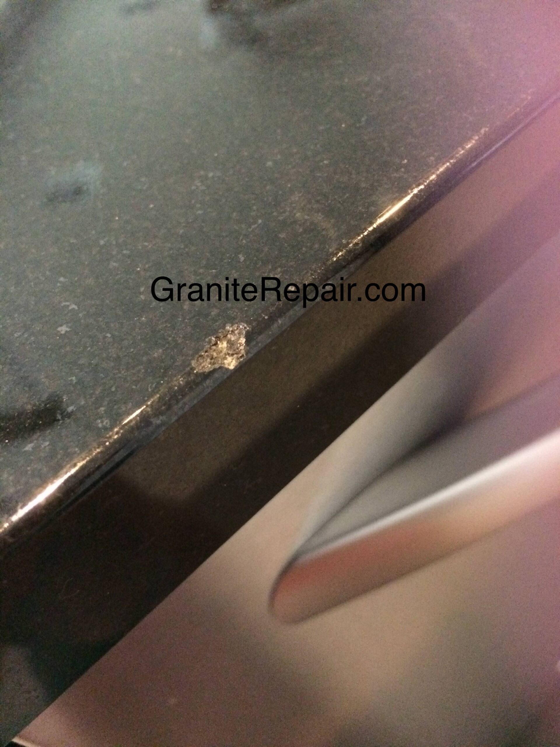 black-quartz-chipped-edge-before-repair